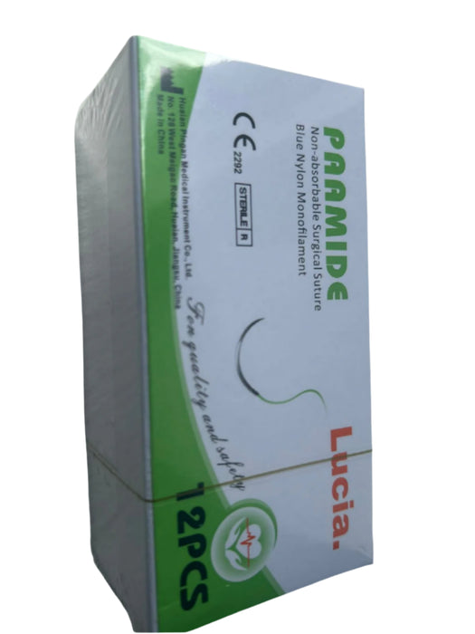 Box of Lucia surgical sutures with green and white design on a gray surface