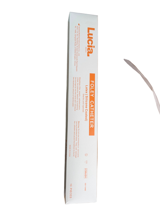 Lucia Foley Catheter retail box in white with orange text, placed diagonally on top of brown cardboard shipping boxes.