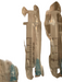 Three packaged medical syringes in clear plastic blister packs with blue needle tips, shown on a light beige surface.