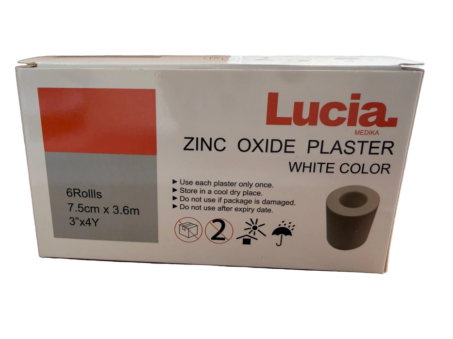 Lucia Medika Zinc Oxide Plaster White Color box containing 6 rolls, 7.5cm x 3.6m (3'x4'), shown on a cardboard surface.