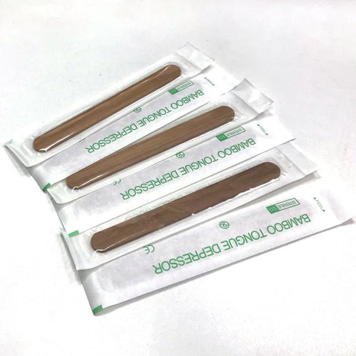 Tongue depressors in packaging on a white background